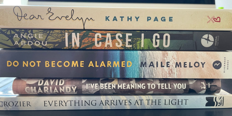 A poem made of book spines stacked on top of one another reads 
